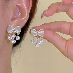 Elegant S925 silver needle bowknot tassel earrings with clear crystals for women