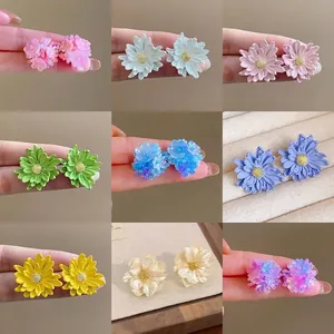 Variety of colorful handmade floral stud earrings for the spring 2025 jewelry collection