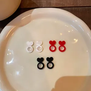 Heart-shaped silicone earring back stabilizers in white red and black colors