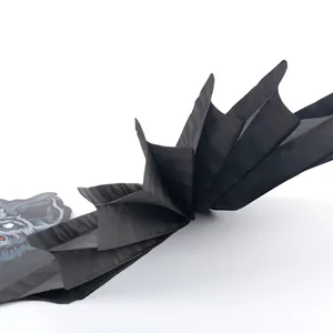 Detail view of black honeycomb paper bat wing Halloween party decoration ornament