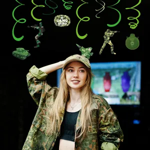 Detailed view of camo military theme party hanging swirls featuring soldier and tank motifs