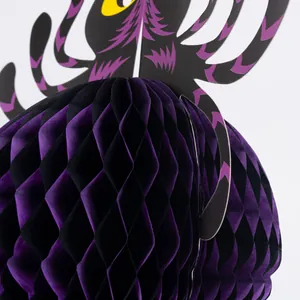 Close-up of purple and black Halloween honeycomb paper hanging decoration