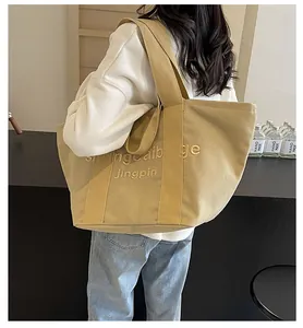 Lässige große khakifarbene Canvas-Tragetasche mit Buchstabenstickerei für Damenmode