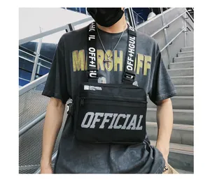 Detailed view of a black hip-hop tactical chest rig bag worn on a streetwear outfit