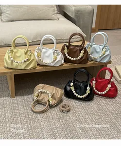 Collection of fashion pleated cloud handbags in various colors with bead straps.