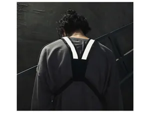 Back detail of urban tactical chest harness with high-visibility reflective strips.