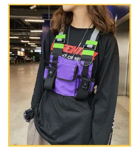 Detail of tactical functional purple chest bag with reflective straps on model