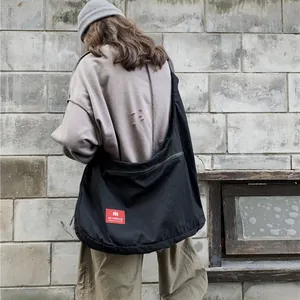 Oversized black canvas messenger bag for men and women street hip-hop fashion style