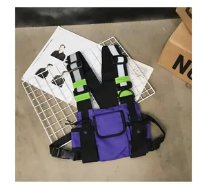 Close-up of tactical purple chest bag featuring reflective strips and multiple pockets.