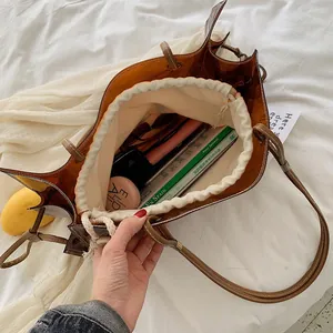 Bolso tote grande ámbar transparente con bolsa interior de lona y asas marrones