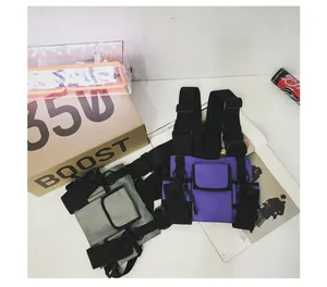 Detailed view of urban tactical functional chest bags in grey and purple with multiple pockets