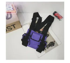 Detailed macro view of a purple tactical chest bag featuring functional techwear utility style