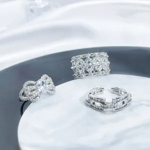 Luxury silver rings set featuring full diamond settings and adjustable open designs.