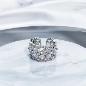 Detailed macro view of silver open ring encrusted with marquise sparkling stones