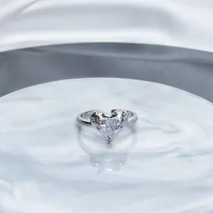 Detailed view of an elegant silver-toned heart-shaped open ring with sparkling pavé crystals