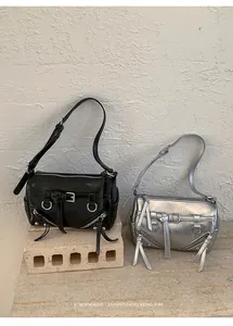 Sophisticated black and silver pillow bags featuring retro minimalist aesthetic design elements