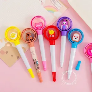 Set of colorful cartoon decompression spinning ballpoint pens with cute decorative tops