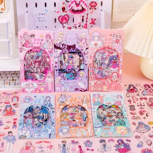 Close-up of various cute anime girl dress-up sticker sets in pastel colors on a desk.