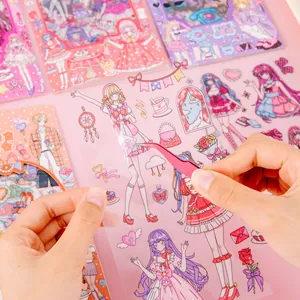 Detailed view of cute anime girl stickers with pink tweezers for decoration