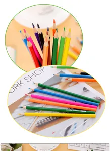 Close-up view of vibrant multi-colored pencils arranged on a creative studio workspace