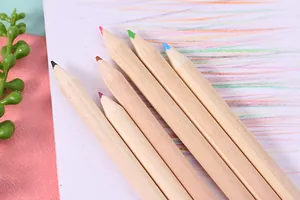 Close-up of natural wooden colored pencils on drawing paper