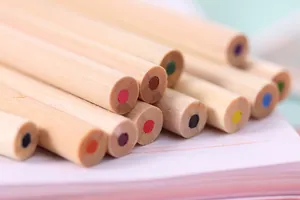 Close-up detail of 12-color wooden pencils showing vibrant lead colors for drawing.