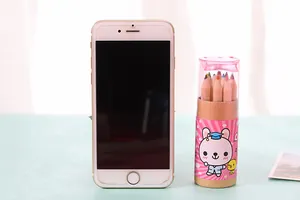 Portable 12-color pencil set in mini barrel shown next to a smartphone for size reference