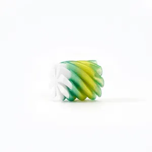 Macro detail of a 3D printed stress relief toy with green gradient spiral texture