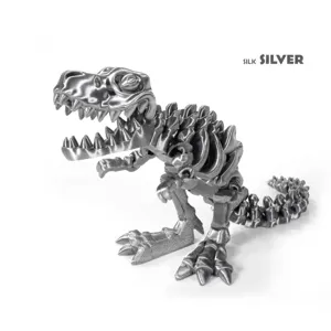 Close-up of a 3D printed T-Rex skeleton figure in silk silver metallic finish