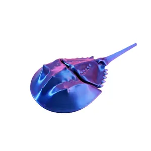 Articulated 3D printed horseshoe crab toy with an iridescent blue and purple finish