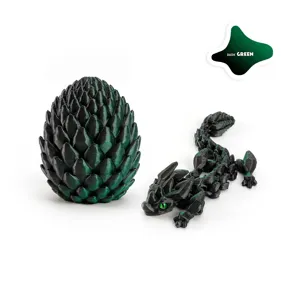 Detail view of 3D printed articulated dragon and matching egg ornament in dark green