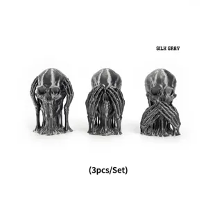 Detailed view of 3D printed Hear-See-Speak No Evil skeleton figurines in silk gray finish