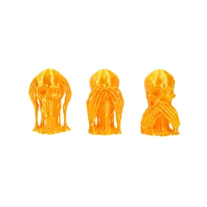 3D printed orange skull set with See No, Hear No, Speak No Evil poses for Halloween