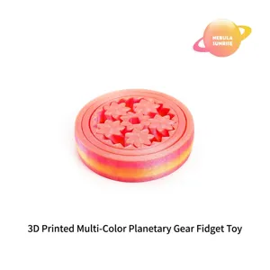 Dettaglio di fidget toy stampato in 3D con ingranaggi rosa e arancione