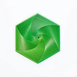 Detailed macro view of 3D printed fractal fidget hexagon in fantasy green color