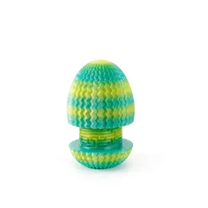 Detailed view of a 3D printed maze dragon egg in a green and yellow gradient finish