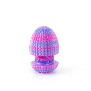 Macro detail of a 3D printed maze dragon egg ornament featuring nebula sunset colors