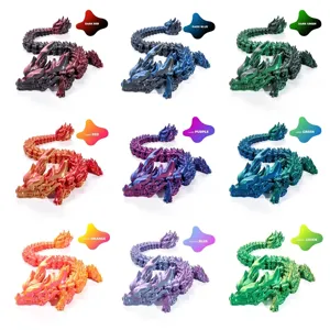 3D printed articulated dragon ornament in nine colors showing flexible joints
