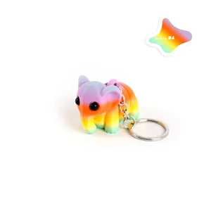 Detailopname van een 3D-geprinte regenboogkleurige gelede olifant sleutelhanger