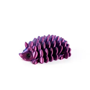 Detail view of a 3D-printed hedgehog toy with a metallic laser purple finish and texture.
