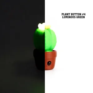 Vue macro détaillée d'un jouet de bureau bouton cactus vert lumineux imprimé en 3D