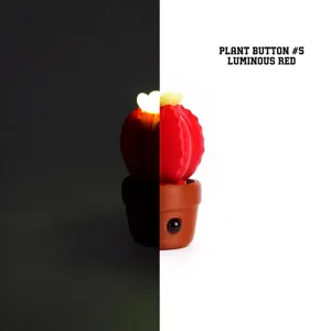 Vue détaillée du jouet fidget cactus 3D montrant l'effet de lueur rouge nocturne
