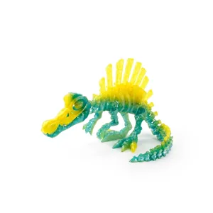 3D printed Spinosaurus dinosaur skeleton figurine in translucent green and yellow