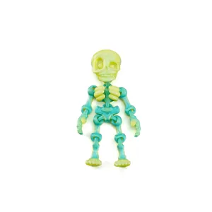 Close-up of articulated 3D printed skeleton figurine in yellow and green gradient