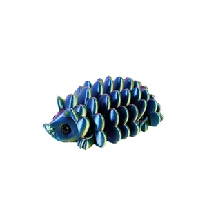 3D printed articulated hedgehog toy with iridescent blue finish for desk decoration.