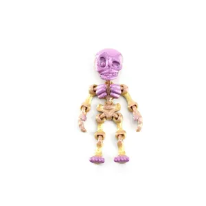 Close-up detail of 3D printed articulated skeleton toy with silk gradient texture