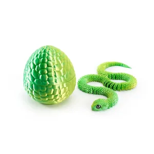 Detailed view of 3D printed articulated snake and matching textured egg in dreamy green color