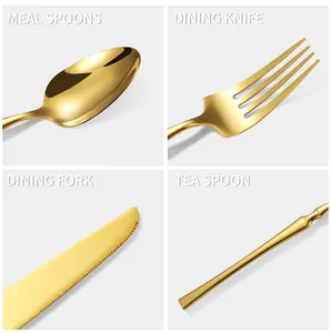Close-up detail of golden stainless steel steak knife and fork with elegant slim handle design