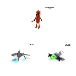 Collection of 3D printed articulated figurines including shark with sneakers and airplane