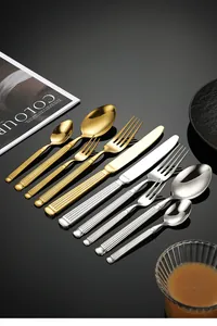 Close-up of 304 stainless steel cutlery set with Roman column handles in gold and silver